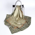 Leopard print satin scarf with golden chain patterns draped over a stylish handbag - Green Gold Chain Leopard