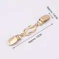 Golden vintage cardigan clip with twisted metal link and duckbill clasps, 13cm length - KC Gold Hollow Knot