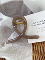 Elegant translucent brown acrylic hair claw clip with a twisted ring design for women - Linen Coffee