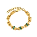 Detailed shot of golden link bracelet featuring vibrant green zircon stones and clasp - Double Zirconia Bracelet - Embossed Texture (CK801)