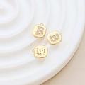Macro view of gold-plated letter B pendant with zircon inlay for jewelry making - Letter B
