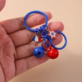 Blue and red star and umbrella keychain with colorful bells on a minimalist hook - Red Blue Bell