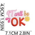 Macro view of 'It will be OK' embroidery patch with daisy and dimension markers - No. 22 (It Will Be OK)