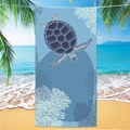 Light blue microfiber beach towel with sea turtle and coral print on beach background - Sea Turtle Beach Towel 3