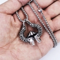Vintage Viking Odin helmet pendant necklace in aged silver held in palm for scale - Bull Horn