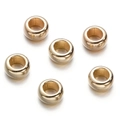 Detailed view of six golden CCB spacer beads with smooth metallic finish on white backdrop - Gold Style 18 (Ring Spacer)