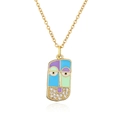 Detailed shot of a gold-plated portrait pendant with colorful enamel and cubic zirconia - Tricolor Patchwork Face Pendant