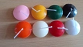 Set of 8 colorful floating disc candles for wedding decor on light wood background - Orange