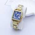 Macro shot of Kimio 3040 gold watch featuring a blue Roman dial and horseshoe lugs - Blue