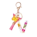 Resin letter V keychain with dried flowers, gradient butterfly, and pink tassel detail - Flower Pattern V