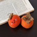 Handmade orange wool felt persimmon keychain with a cute smiling face and metal ring - Persimmon