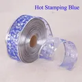Detalle de cinta azul transparente con estrellas y copos de nieve plateados estampados - Azul Bronceador / 100 Yardas/5CM de Ancho