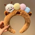 Cute brown plush caterpillar headband featuring colorful pompoms and bear face design - Brown Plush Ball