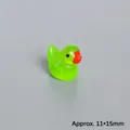 Macro view of glowing green resin miniature duck figurine with size specs Approx. 11*15mm - Glow In The Dark Grass Green