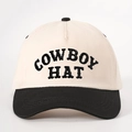 Detalle del bordado negro COWBOY HAT en una gorra trucker bicolor en crema y negro - Talla única / Beige y Negro