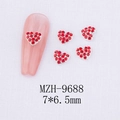 Detailed macro view of 7x6.5mm red heart nail gems on silver alloy claw settings - Heart Style (9688)