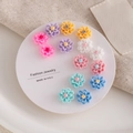 Detailed view of colorful floral resin stud earrings on a white jewelry display card - Colorful Resin Flower (E0172-1)