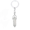 Detail view of a hexagonal white marble crystal pendant on a silver keychain link - Howlite
