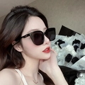 Chic oversized square black polarized sunglasses with golden temple accents on model - Korean Style Black Frame Grey Lens