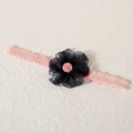 Pink elastic headband for babies featuring a large black lace flower and plush center - Burned Edge Ball Navy
