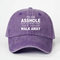 Detail view of purple washed cotton baseball cap featuring white slogan print - Purple