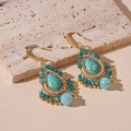 Detail of vintage flower drop earrings with turquoise stones and golden tassels - Blue Flower Water Drop Tassel Ear Hook