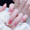 Short oval press-on nails featuring pink gradient, white cream drips and rainbow clouds - R825 Dream Rainbow / Nail Glue Version