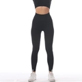 High-waisted black yoga leggings with seamless sculpting effect and elastic fit - S / Black