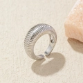 Detail of silver croissant dome ring with textured vertical stripes and open band design - Adjustable Open / Silver Spiral