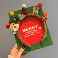 Christmas reindeer antler headband with festive tree and gift box on green card - Light Up Twisted Reindeer