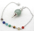 Macro view of healing pendulum with seven chakra beads and green aventurine sphere - Green Aventurine