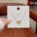 Collana in acciaio al titanio oro rosa con eleganti ciondoli a doppio cuore intrecciati - Stile Cuori Intrecciati (X145) / Oro rosa