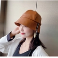 Detail of a brown faux leather fisherman hat featuring a stylish side zipper design - Yellow Zipper (Brown Bucket Hat)