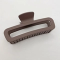 Close-up of a large coffee brown matte rectangle hair claw clip on white fabric - Large (13CM) / Brown