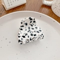 Medium acetate hair claw clip in cream white with black star patterns - Small Stars