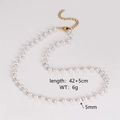 Detail view of pearl and gold chain necklace with 42+5cm length and lobster clasp - 5mm