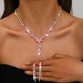 Close-up of a pink marquise gemstone bridal necklace and matching tassel earrings set - Necklace and Earring Set / Pink