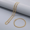 Ensemble collier et bracelet gourmette en acier inoxydable doré sur fond bleu - Parure Collier et Bracelet / 3.5mm / 20cm / Or