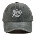 Detail of BELIEVE embroidery with Sasquatch and mountains on vintage washed baseball cap - Adjustable / Green