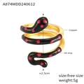 Detail of snake shaped gold plated copper ring with red dotted black oil drip finish - One Size/Open / Gold Black