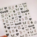 M-1074 nagelstickers met zwarte hartjes, gouden vlinders en pied-de-poule patronen - M-1074 Brons