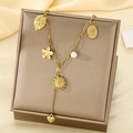 Gold stainless steel necklace with heart sunflower and pearl charms on a display box - Multi-Element Sunflower Heart Style (KN297599-SXSJ)