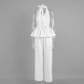 Detailed view of polka dot peplum halter top and wide-leg trousers set for women - S / White