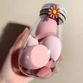 Close-up of pink makeup sponges in a glass jar with daisy hair tie decoration - Strawberry Mousse 6 Pcs