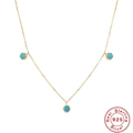 Detail van S925 zilveren ketting met turquoise hangers in roségouden afwerking - Drie Ronde Stenen Stijl / Goud