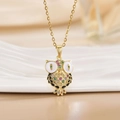 Exquisite gold owl necklace with multi-color gemstones on white ceramic display - Gold Owl/Multicolor Enamel Gem