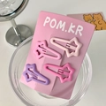 Cute set of four matte star-shaped hair clips in various pink and purple macaron colors - Long Star