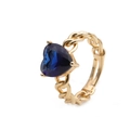 Adjustable golden cuban link ring with faceted blue heart crystal stone on white background - Adjustable Open / Blue Heart