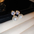 Macro shot of pearl stud earring with sparkling zircon on premium gold plated base - Gold Pearl - Round (60# Silver Needle)