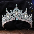 Detail shot of a silver bridal crown with light blue crystals and leaf-shaped decor - Silver White & Green Jelly Rhinestone